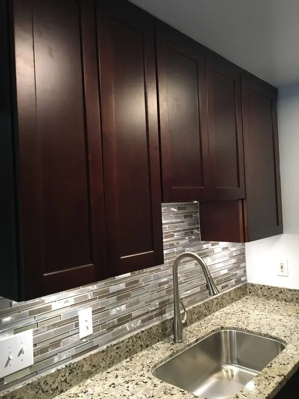 Kitchen cabinets in Vallejo: dark espresso cabinets with mosaic backsplash