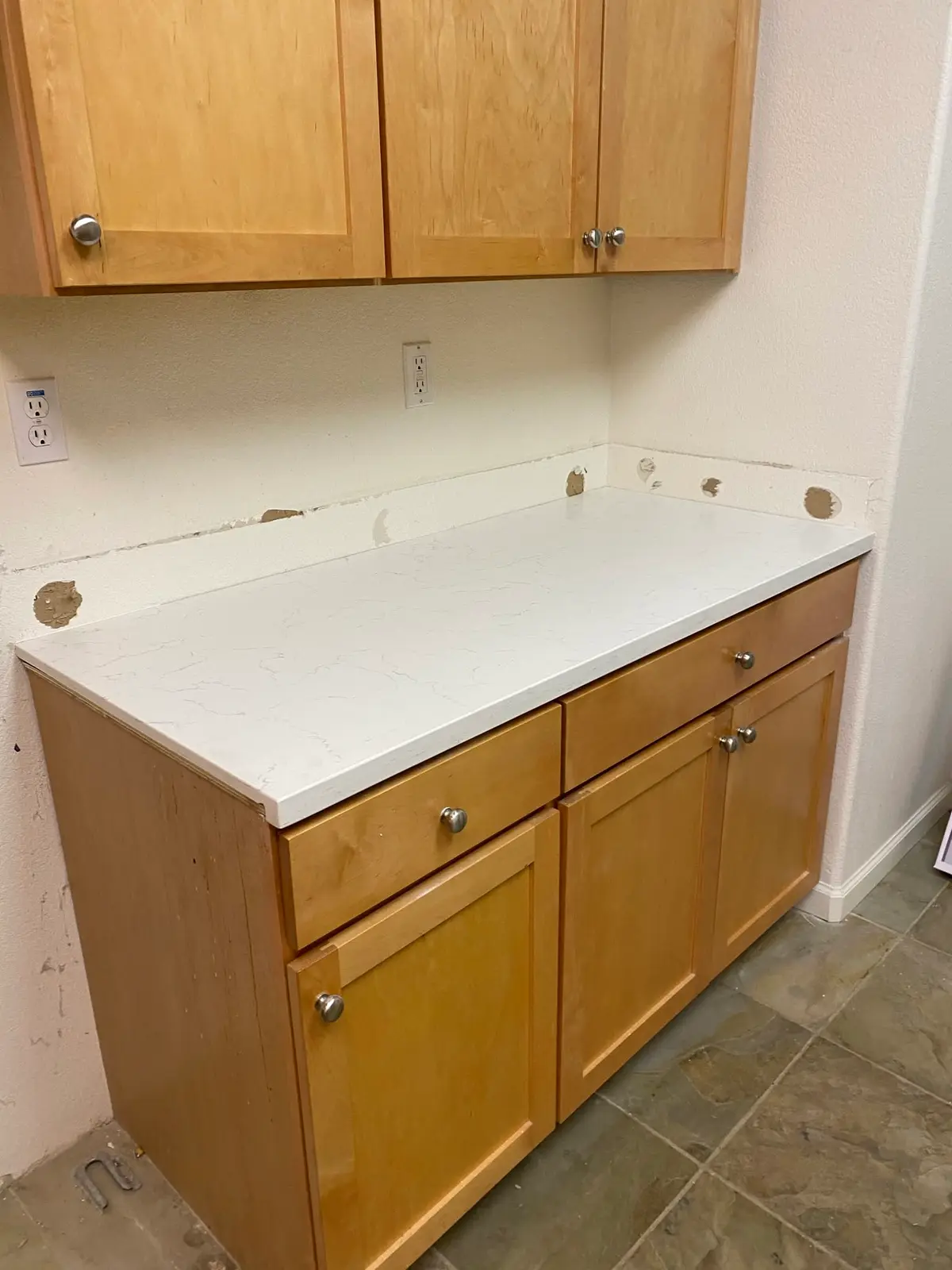 General contractor in Strawberry: white quartz counter on honey oak cabinets