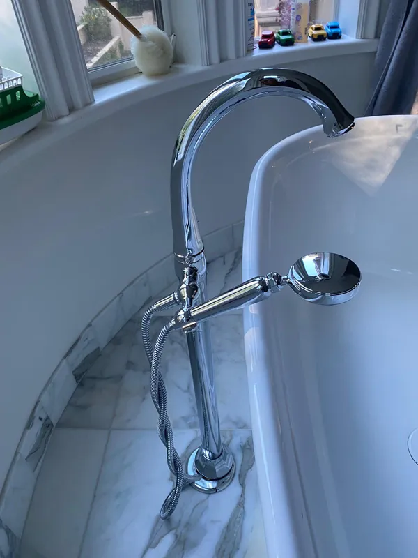 Floor-mounted tub filler beside a freestanding tub in a Vallejo bathroom