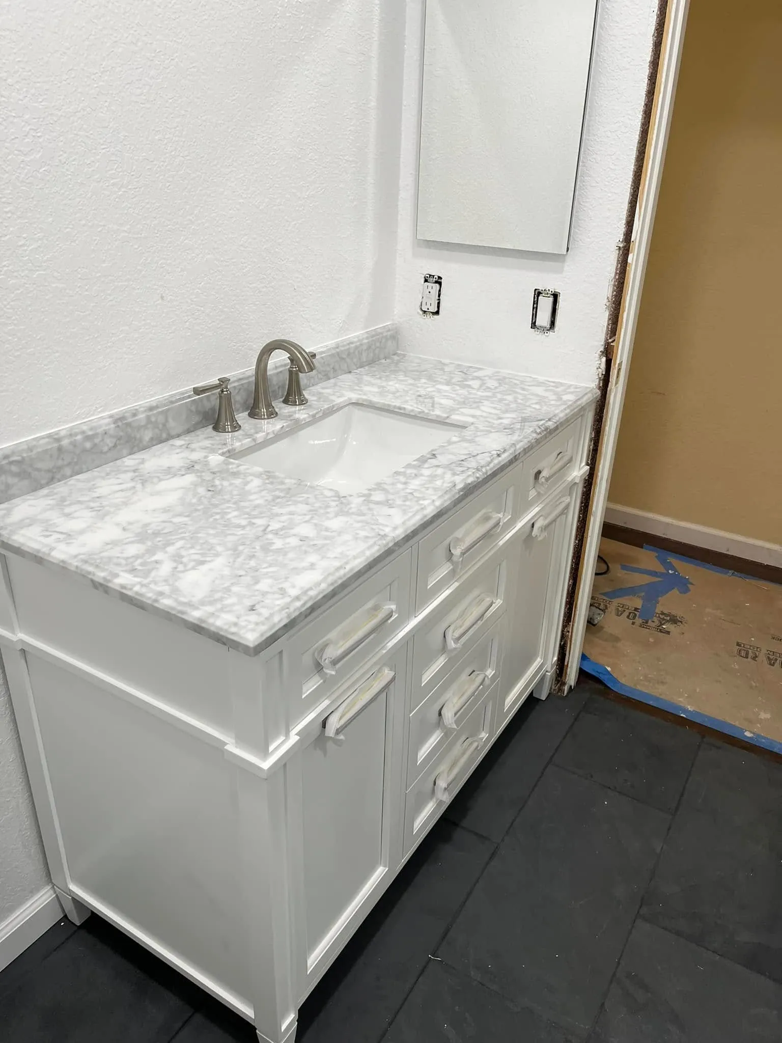 Marble-top bathroom vanity with an undermount sink in Vallejo