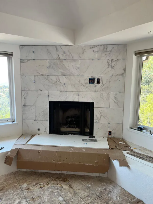 Marble-look tile fireplace surround in a Vallejo home remodel