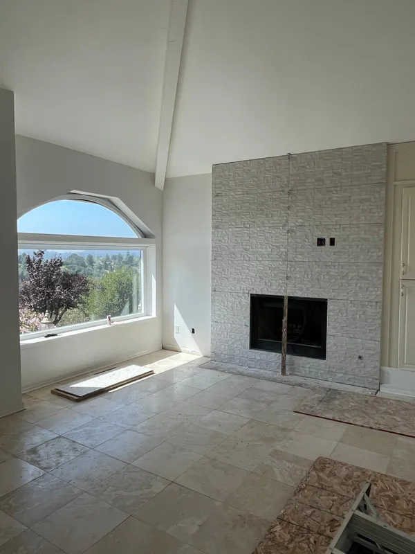 Stacked stone tile fireplace wall in a Vallejo living room remodel