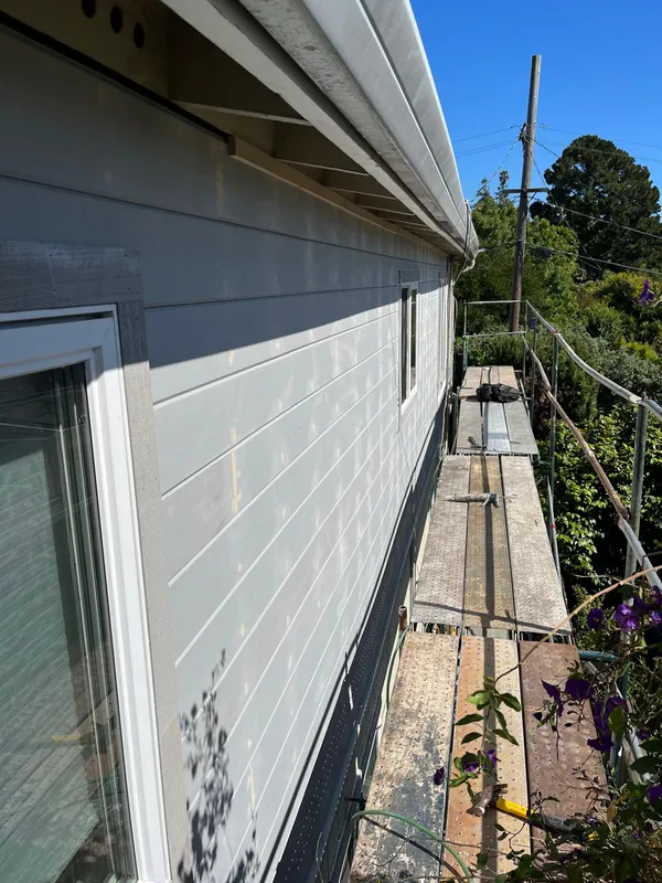Gray siding installation from scaffolding on a Vallejo home