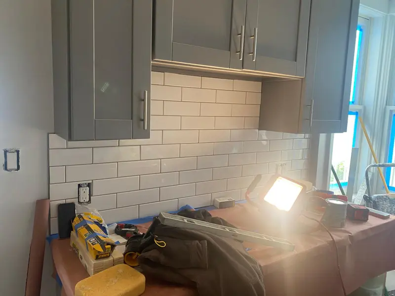 Kitchen remodeler in Vallejo installing gray shaker cabinets and subway tile