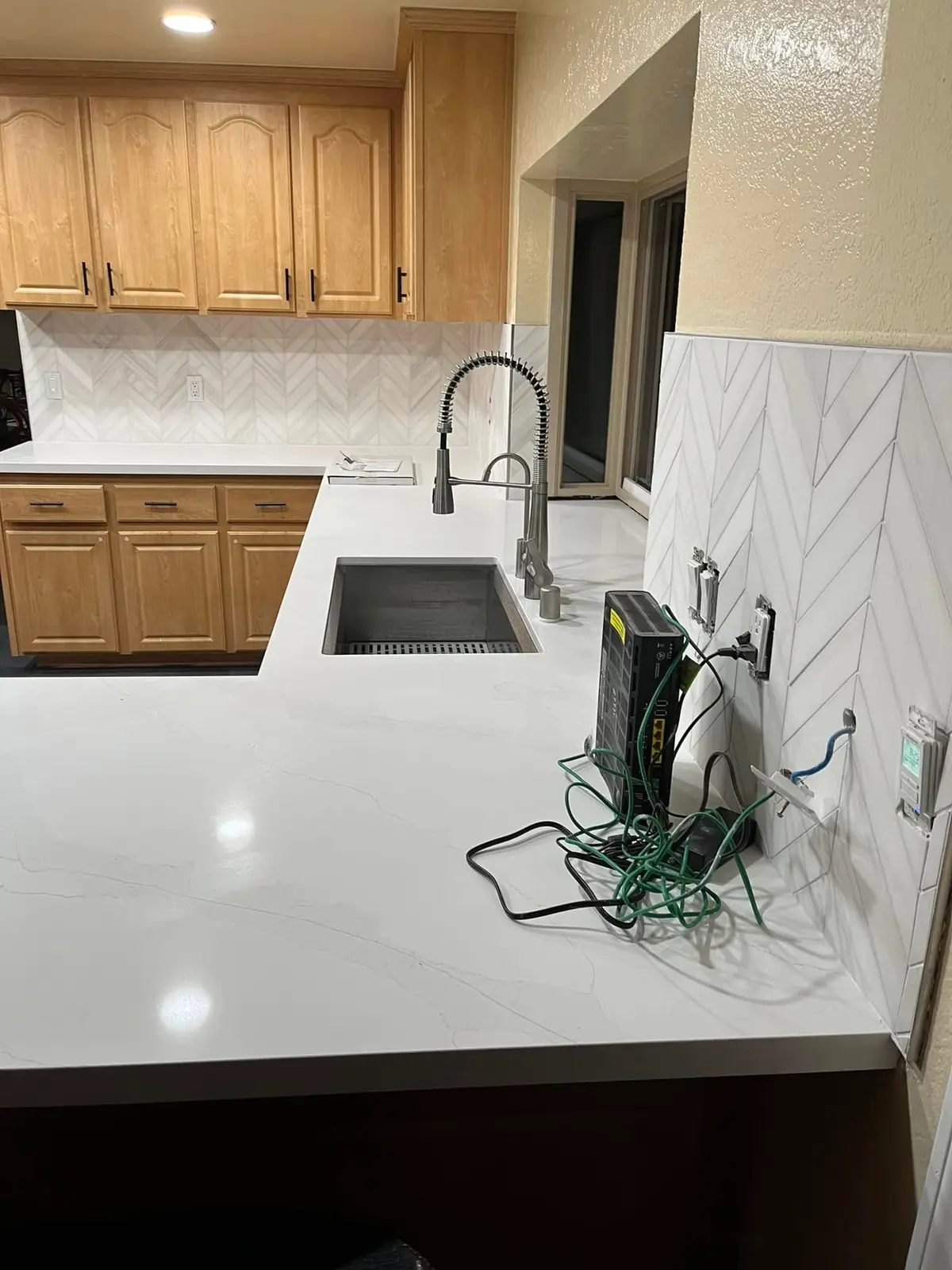 About E&MC Remodeling: kitchen remodel with herringbone backsplash in Vallejo