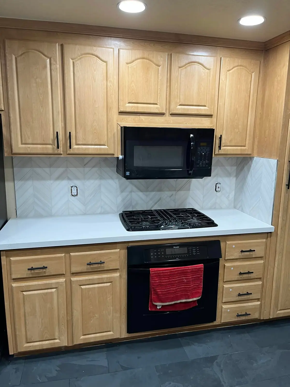 Kitchen remodeling in Vallejo with quartz counters and herringbone tile backsplash