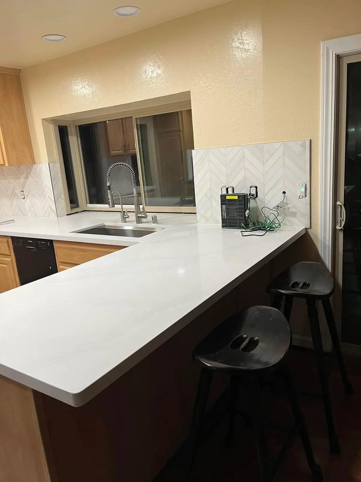 General contractor in Marin County: finished quartz kitchen peninsula with undermount sink