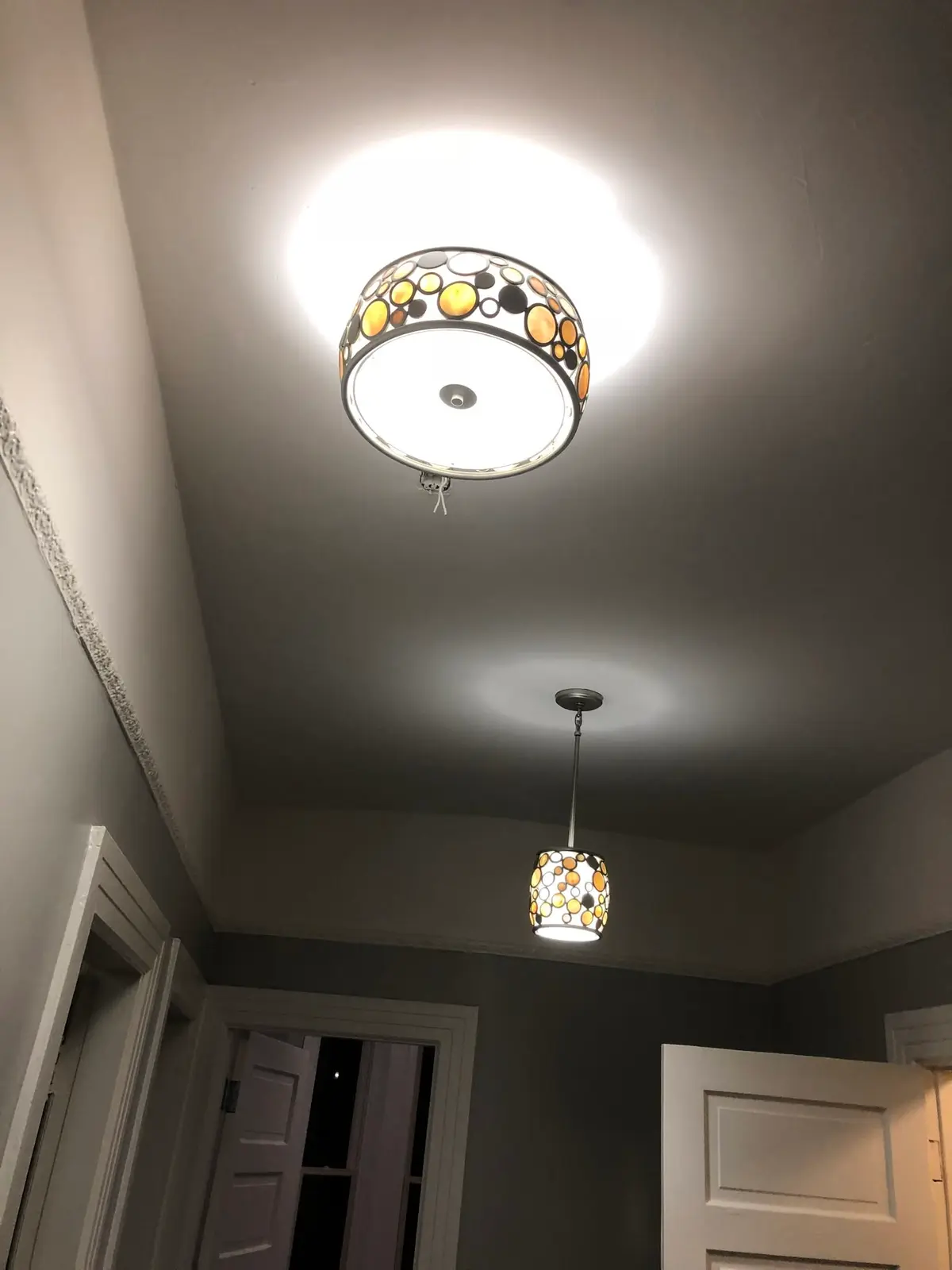 Electrician in Vallejo: ceiling fixture and pendant in a dark gray room