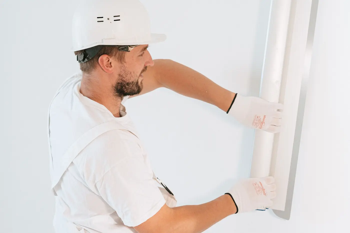 Drywall repair in Vallejo: worker fixing an interior wall