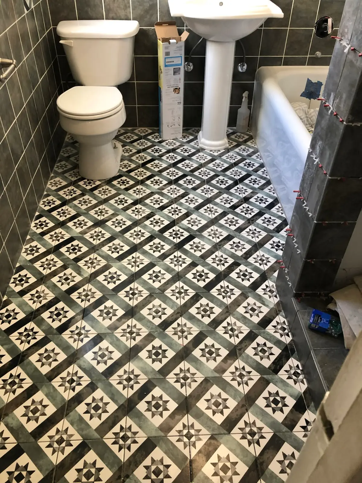 Tile contractor in Vallejo: black and white cement-pattern tile bathroom floor